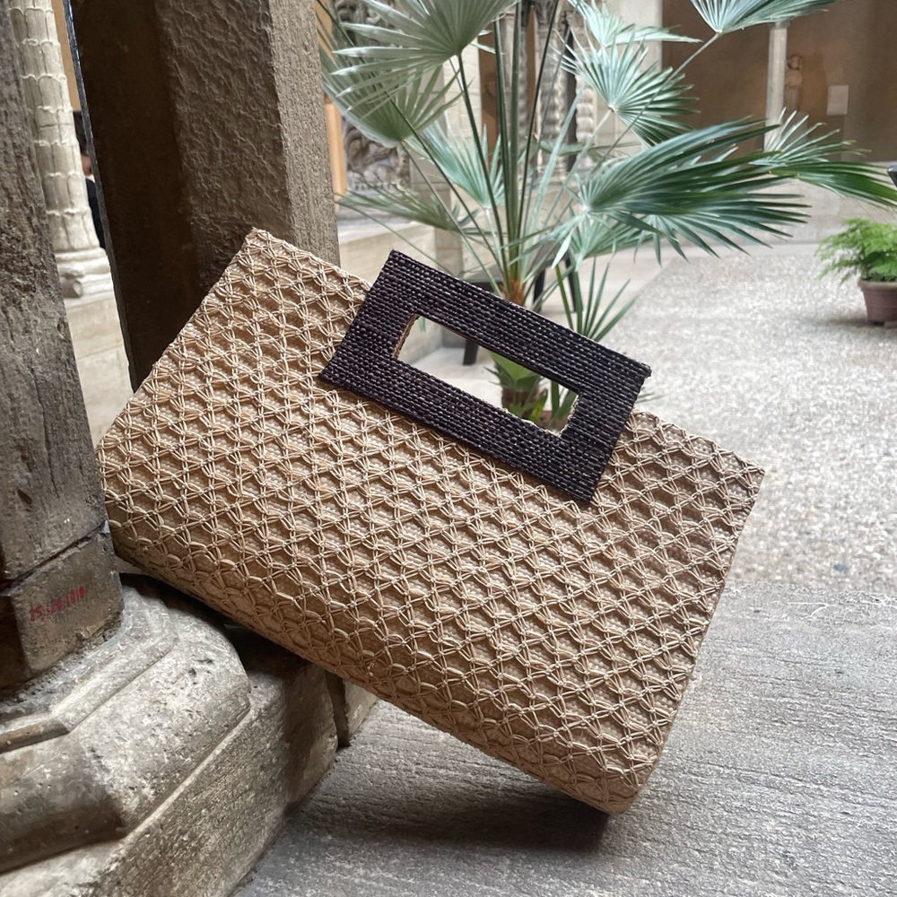 Hand-woven raffia clutch with handle